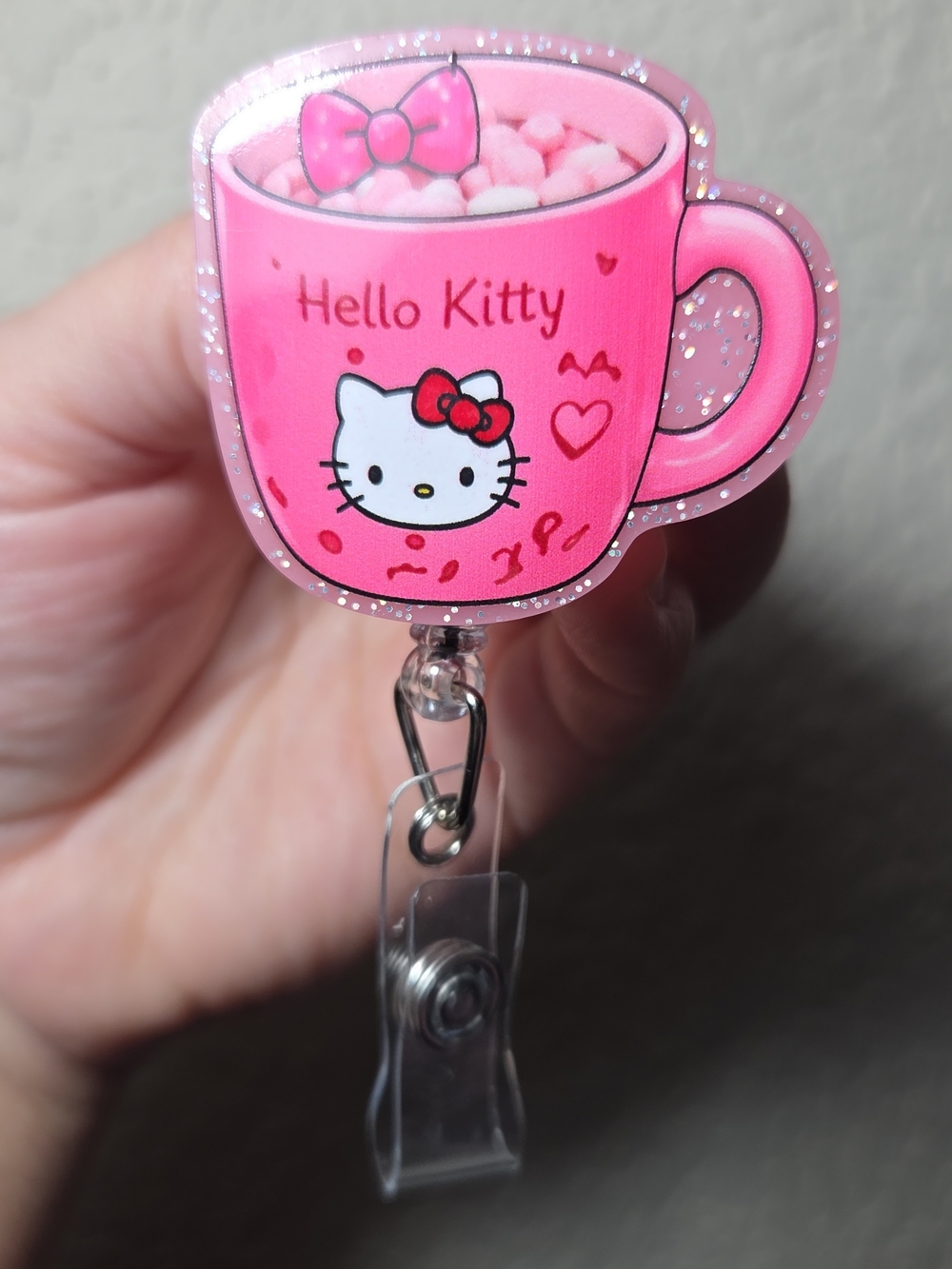 Hello Kitty Pink Cup Badge Reel with Glitter Trim